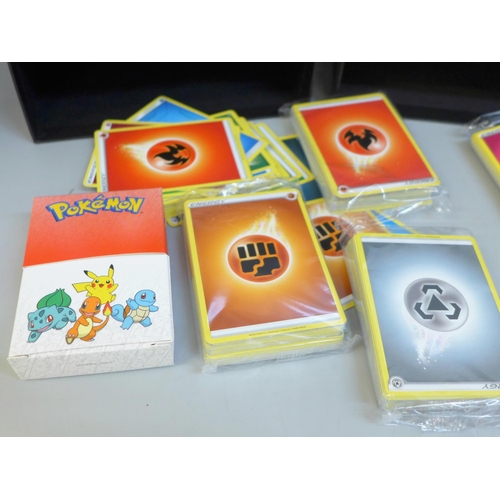 683 - Pokemon cards, cards from eleven energy bundles and spare boxes
