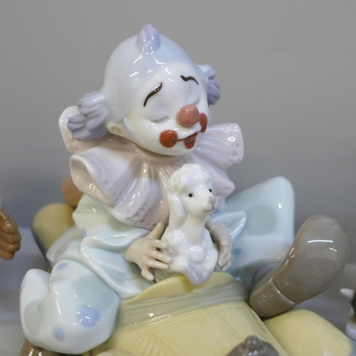 689 - Two Lladro figures of clowns, clown in car a/f and a Lladro figure of a young baseball player on one... 