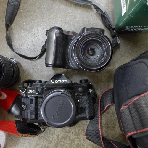 693 - A Canon camera lens, equipment etc, in a carry bag and a Fujifilm S602 zoom digital camera