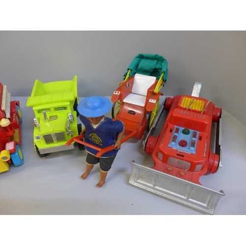 697 - Toys including Marx Hill climbing dump truck, Disney fire engine, Fire Department boat, a boxed bull... 