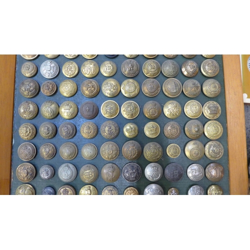 714 - 140 Mounted vintage military buttons and loose military buttons plus a book, Buttons of The British ... 