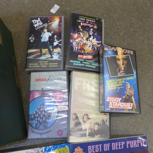 715 - A box of rock VHS videos, Queen, David Bowie, Sex Pistols, Pink Floyd and music books (learn to play... 