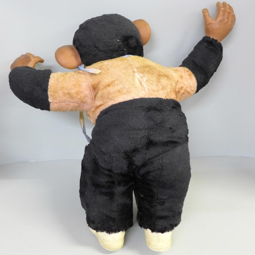 722 - A vintage straw filled chimpanzee, 47cm, a/f