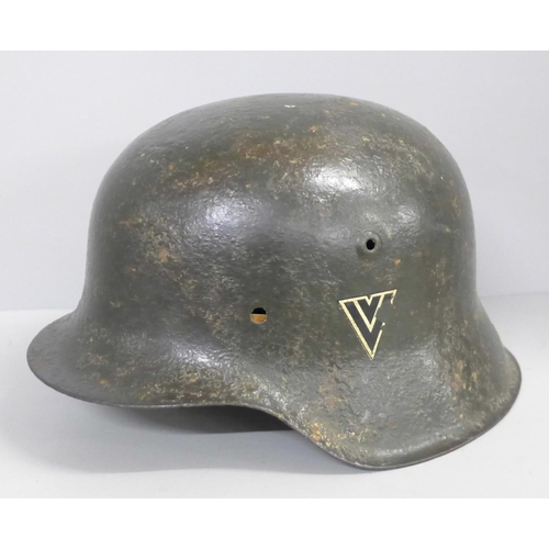 730 - A German WWII period helmet with liner