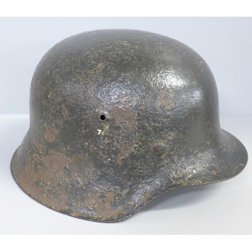 730 - A German WWII period helmet with liner