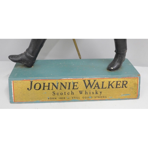 765 - A Johnnie Walker Scotch Whisky advertising figure, 40cm