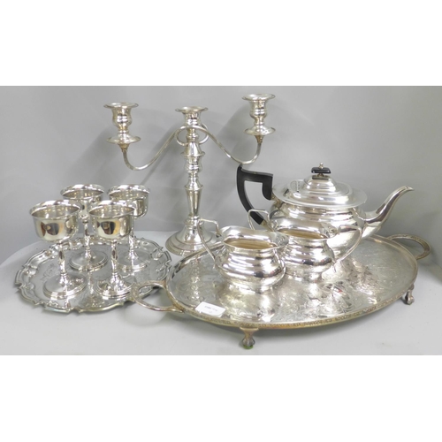 774 - A Viners three piece plated tea service and a similar chased tray, a candelabra, another tray and fo... 