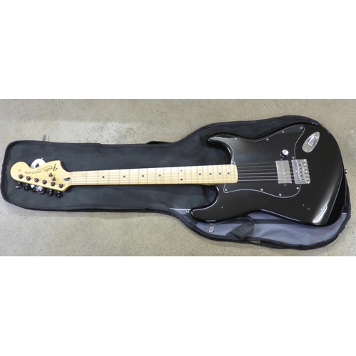 777 - A Fender Stratocaster electric guitar, Squire body and Fender neck, with soft case