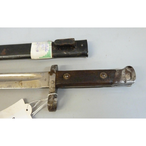 788 - An Austrian 1895 pattern Manonlicher bayonet with marks CE over WG, with scabbard