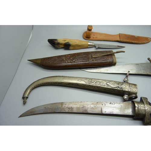 790 - An Eastern dagger with scabbard, one with hoof handle and scabbard and one other dagger