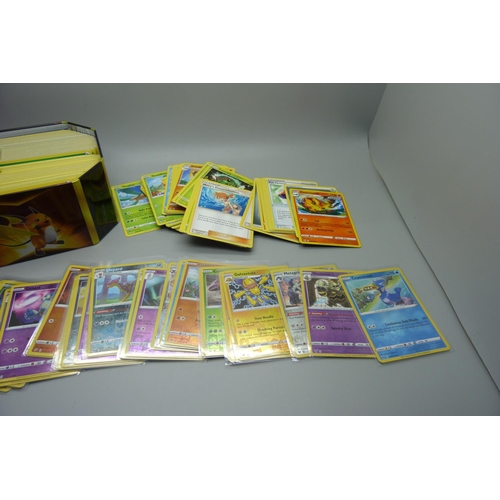 808 - 300 Common/uncommon/rare Pokemon cards and 30 reverse holo/holo cards