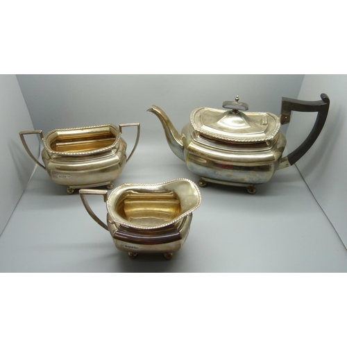 814 - A three piece Walker & Hall silver tea service, 1236g, (40oz.)