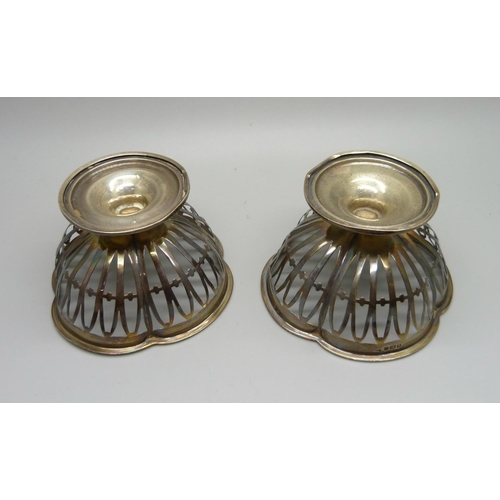 824 - A pair of pierced silver Walker & Hall sweetmeat dishes, Sheffield 1910, 76.6g