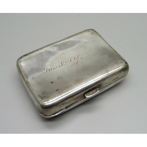 832 - A Victorian silver cigarette case with inscription, 84g, and a collection of pen nibs