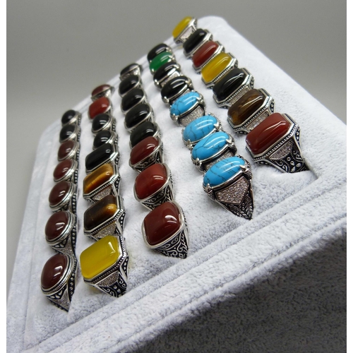 855 - A collection of thirty-eight silver plated and stone set rings