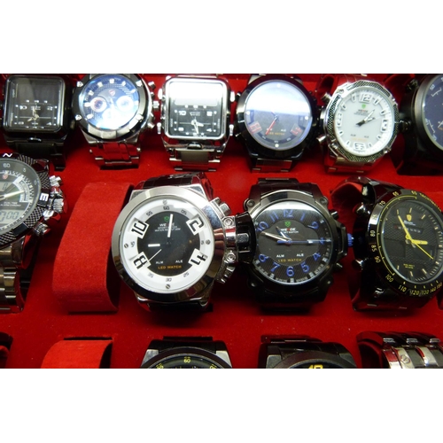 877 - A collection of wristwatches, WEiDE and Shark, in a metal case, (20), WEiDE watches with button oper... 