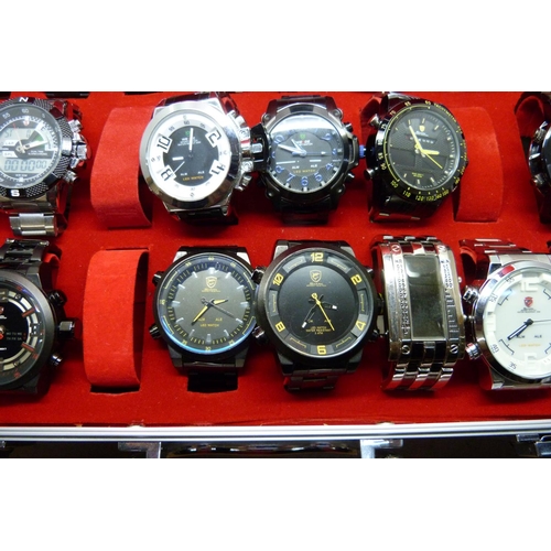 877 - A collection of wristwatches, WEiDE and Shark, in a metal case, (20), WEiDE watches with button oper... 