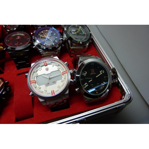 878 - A collection of wristwatches, WEiDE and Shark, in a metal case, (20), WEiDE watches with button oper... 