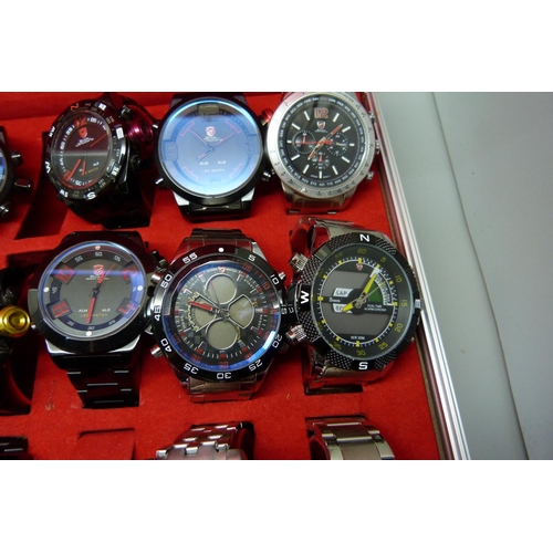 878 - A collection of wristwatches, WEiDE and Shark, in a metal case, (20), WEiDE watches with button oper... 