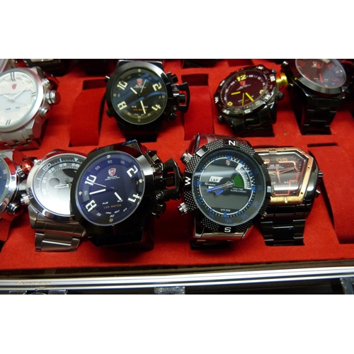 878 - A collection of wristwatches, WEiDE and Shark, in a metal case, (20), WEiDE watches with button oper... 