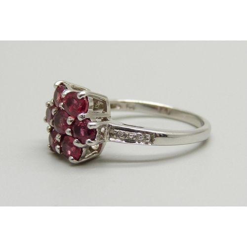 890 - A 9ct gold and tourmaline cluster ring with diamond shoulders, 3.2g, N