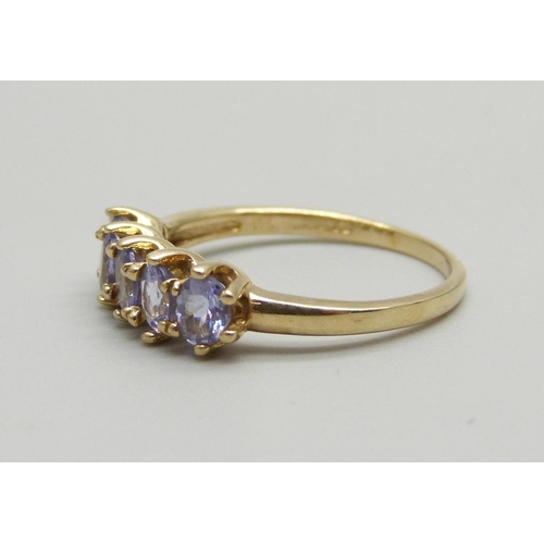 891 - A 9ct gold and five stone tanzanite ring, 2.4g, O