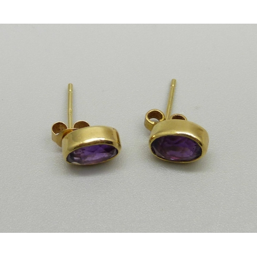 892 - A pair of 18ct gold and amethyst earrings, 2.3g