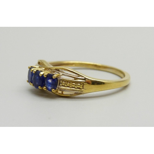 894 - A silver gilt and three blue stone ring, T