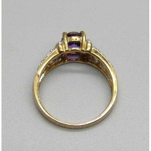 897 - A 9ct gold, amethyst and twenty stone diamond ring, 2.7g, N