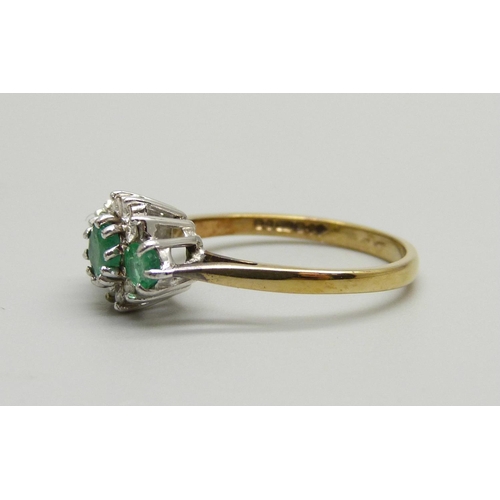 900 - A 9ct gold, emerald and diamond cluster ring, 2.1g, N