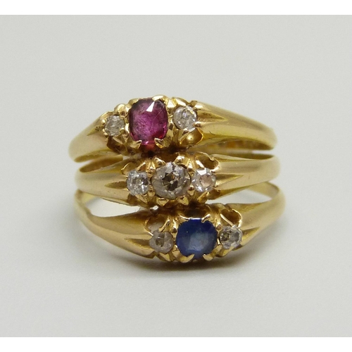 908 - A Victorian 18ct gold triple ring set with diamonds, a sapphire and a ruby, (three rings placed toge... 