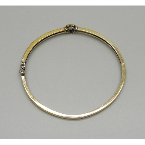 912 - A silver gilt and tanzanite bangle