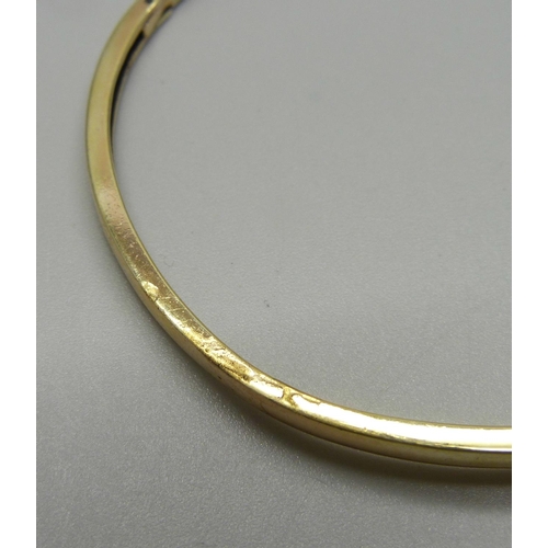 912 - A silver gilt and tanzanite bangle