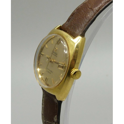 917 - A lady's 18ct gold Omega Seamaster Cosmic date wristwatch with second sweep hand, gross weight 27.8g... 