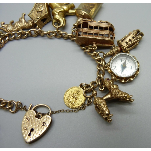 964 - A 9ct gold charm bracelet, with twelve hallmarked 9ct gold charms and a yellow metal charm, 73.3g