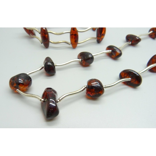 967 - A silver and amber necklace and bracelet set