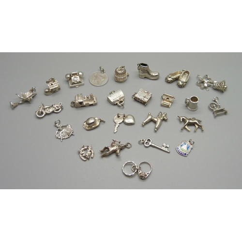 979 - Twenty-five silver and white metal charms, all stamped or test as silver, 72g