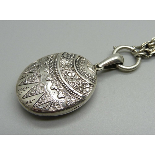 982 - A Victorian silver locket and chain, locket hallmarked Chester 1881, locket 27mm wide, chain require... 