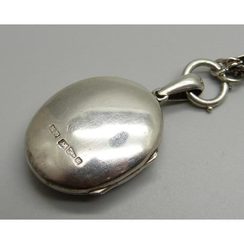 982 - A Victorian silver locket and chain, locket hallmarked Chester 1881, locket 27mm wide, chain require... 