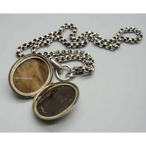 982 - A Victorian silver locket and chain, locket hallmarked Chester 1881, locket 27mm wide, chain require... 