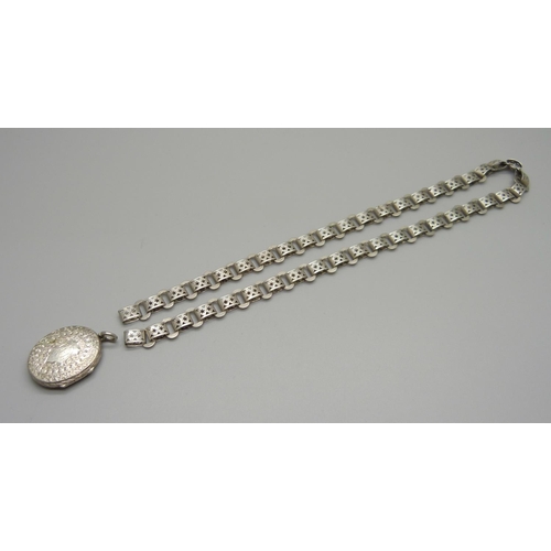 984 - A Victorian silver locket and a chain/collar lacking fasteners