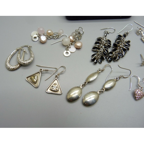 997 - Eleven pairs of silver earrings