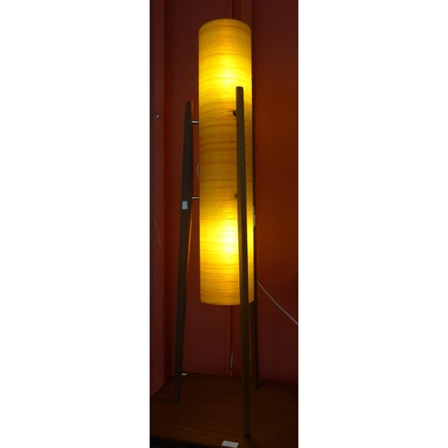 10 - A teak and orange fibreglass floor standing rocket lamp