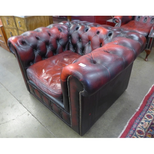 111 - An oxblood red leather Chesterfield club chair