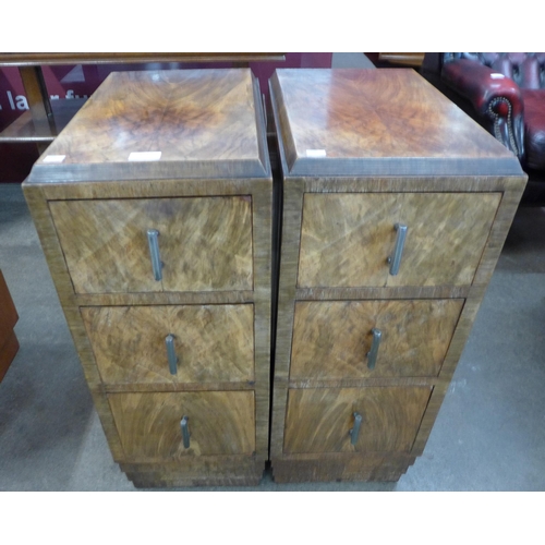 113 - A pair of Art Deco figured walnut pedestal chests