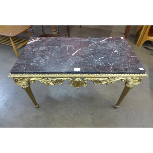 116 - An Italian Rococo style gilt wood and marble topped coffee table