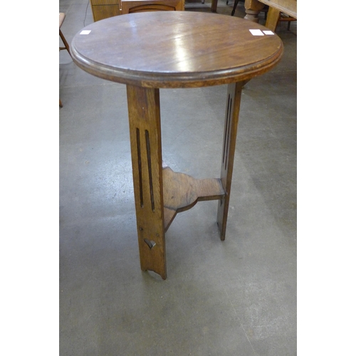 121 - An Arts and Crafts oak occasional table