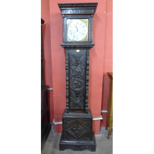 127 - A 17th Century style carved oak 30-hour longcase clock, the silvered dial signed J. Oatway, Orringto... 