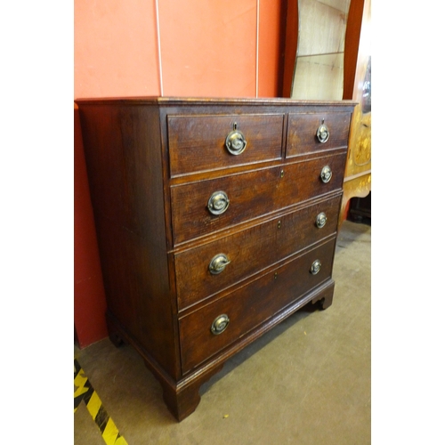 129 - A George III oak chest of drawers