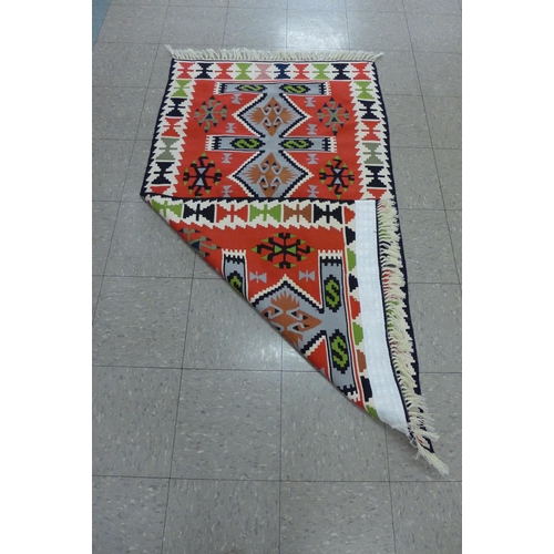 136 - A Turkish multicoloured rug